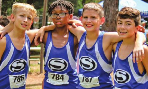 THE SNOOK BLUEJAY cross country team ran at the Cooper Dragon Cross Country Invitational in Tomball last Saturday, Sept. 4. Pictured, from left, are Barrett Dudensing, John Carr, Caiden Gill and Braedyn Fannin. They competed in the sixth and seventh-grade division.