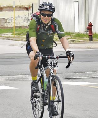 BIKERS FROM the MS 150 bike ride arrive in Somerville on Sunday, April 28. The event raised money for the Multiple Sclerosis Society, and local residents gathered to cheer them. -- Tribune photo by Roy Sanders