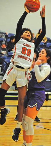 JAE MATHIS SHOOTS a basket during the Caldwell-Florence game last Friday. Mathis scored 17 points in the Lady Hornet win.