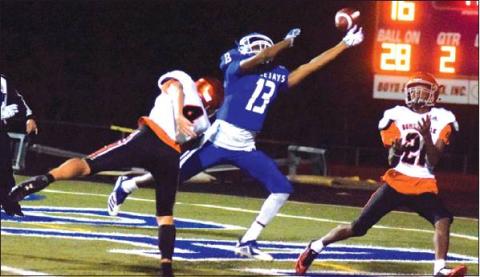 SNOOK’S JERMAINE KEARNEY TIPS THE BALL away from Somerville’s Dominic Tucker in the end zone, preventing a Somerville touchdown Friday night. Also pictured is Yegua wide receiver Johnny Legg. -- Tribune photo by Denise Hornaday