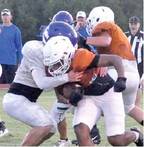 KRIS CARROLL carries the ball last Friday against Robinson in the Hornets first scrimmage. -- Tribune photo by Roy Sanders
