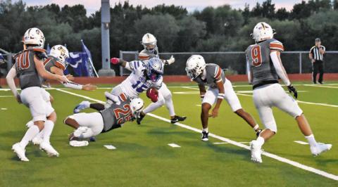 ROGELIO HERNANDEZ OF Caldwell makes a tackle against Crockett. The Hornets won the opener 47-32. Tribune photo by Roy Sanders