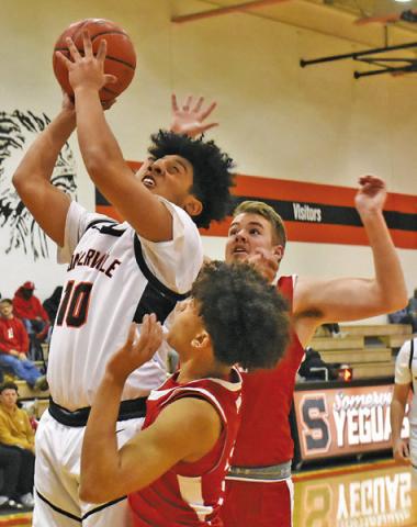 JORDAN SMITH OF Somerville takes a shot against Burton. Tribune photo by Roy Sanders