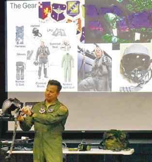 COLONEL LANCE BURNET, USAF (ret.), showed area children some of his flight gear at the Caldwell Civic Center during last week’s “Ready for Take-Off!” event, hosted by the Harrie P. Woodson Library.