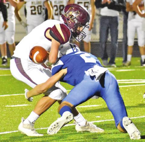 SNOOK’S LANCE LARA makes a jarring tackle and causes this fumble against Milano. -- Tribune photo by Roy Sanders