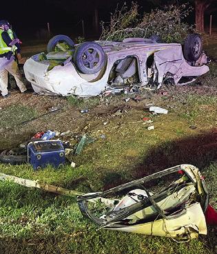 THE WRECKAGE of this car is shown after a rollover accident on F.M. 975. See story inside.