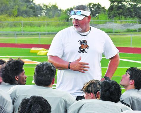 CALDWELL HEAD COACH Sean Witherwax addresses his team after the Anderson-Shiro scrimmage. -- Tribune photo by Roy Sanders
