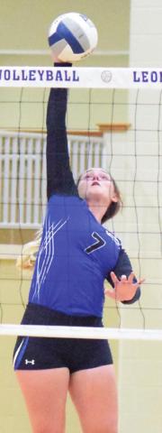 ALEXIS MACIK reaches to push the ball over the net during the Snook-Mexia match last week in the Leon Volleyball Tournament.