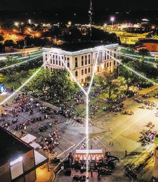THIS AERIAL PHOTO of downtown Caldwell was taken during one of the Caldwell Main Street Summer Concert Series events last year. This Saturday, Texas Unlimited Band (TUB) will open up the 2024 series at 8 p.m.