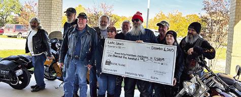 THE SOMERVILLE LAKE LOONS BIKE CLUB makes a donation at the 2023 Food for Families food drive. Photo courtesy of Janice Easter