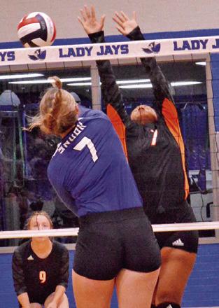 SNOOK’S ALEXIS MACIK hits the ball past Somerville’s Emma Williams last Friday.