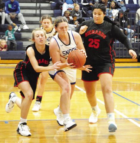 SNOOK’S ALEXIS MACIK FIGHTS WITH Richards players for possession of the ball during the Lady Jays’ win over the Lady Panthers last Tuesday. -- Tribune photo by Denise Squier