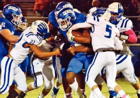 SNOOK’S ANTONIO LOTT, Konnor Eldridge and Jason Barker make a tackle against Bartlett. -- Tribune photo by Roy Sanders