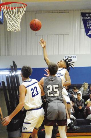 SNOOK’S JOHN CARR shoots against Fayetteville in last Tuesday’s game in Snook. -- Tribune photo by Denise Squier
