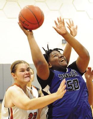 MYKIA MUNSON puts up a shot against Caldwell on Saturday at the Lady Hornet Classic. -- Tribune photo by Denise Squier