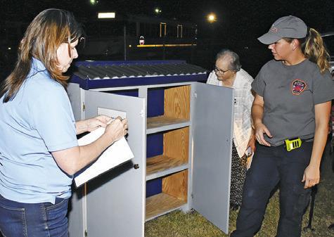 THE FOOD PANTRY is unloaded at the Snook Fire Station. Pictured are, from left, Cindy Jarrott of Snook EEA, Beth Collins of Snook Volunteer Fire Department and Ann Sebesta of Snook EEA. See story inside.