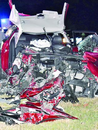 THIS KIA OPTIMA car was destroyed on Monday night in a head-on collision on State Highway 36, just north of Lyons. Tribune photo by Roy Sanders