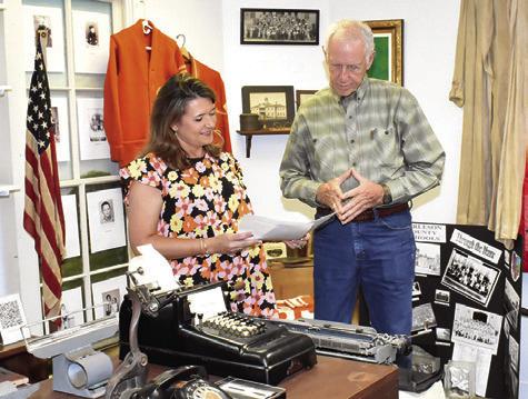 AMY JURICA AND Steve Tunnell look over these items at the Burleson County Historical Museum at the county courthouse.