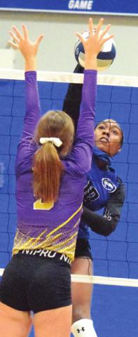 JAIVAN STRINGFELLOW gets one of her seven kills against Weimar at the Snook Gym on Friday. -- Tribune photo by Denise Hornaday