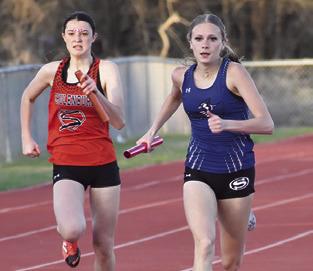 DAKOTA KIENOW closes in on the finish line during a relay at the Koppers Relays back in March. Kienow qualified for the state track meet in the girls triple jump.