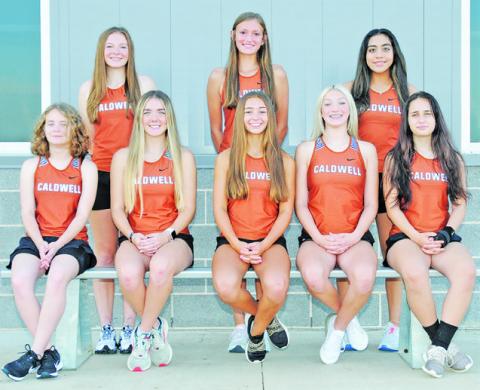 THE 2022 CALDWELL LADY HORNET CROSS country team is, from left, sitting, Fallyn Anderson, Hannah Muzny, Natalie Eastepp, Kori Archer, Ella Bares, standing, Cadie Coston, Kysen Toney and Isabel Alcocer. Not pictured are Gezlynn Wolfe, Adeline Hicks and Kaylan Groce. -- Photo courtesy of Dianne Pursch Photography