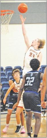 CALDWELL’S HARRISON Novak leaps high for this shot against Manor New Tech. -- Tribune photo by Denise Squier