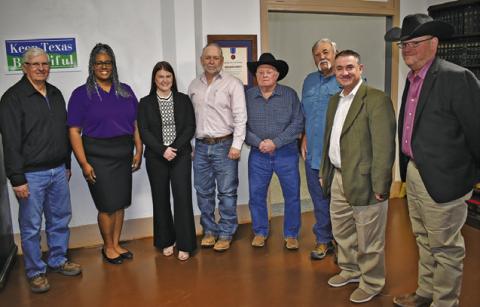 BURLESON COUNTY COMMISSIONERS are joined by Ashley James and Briana Mackey, second and third from the left, and by Eric Zimmerman and John Grange, far right. The commissioners include Vincent Svec, Burleson County Judge Keith Schroeder, and Commissioners David Hildebrand and Bobby Urbanosky.