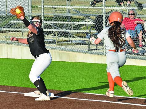 JAELYNN GEST TRIES TO outrun the throw to first during the Caldwell-Giddings game last Friday night at Weiss Field. Tribune photo by Roy Sanders