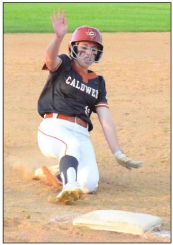 KELLY URBANOVSKY slides safely into third base during Caldwell’s win over Cameron Yoe last Monday. -- Tribune photo by Denise Squier