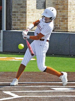 BRYNN MORTON hits the ball during the Caldwell-Glenn tournament game last Thursday at Weiss Field. Tribune photo by Denise Squier