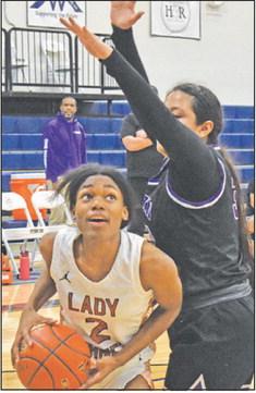 CALDWELL’S MYA Knoxson looks to shoot the ball during the Lady Hornet’s blowout win over Austin Achieve last Friday night.