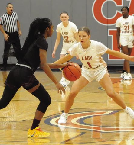 CALDWELL’S LYDIA HICKS defends during Caldwell’s 4431 win over Hearne last Tuesday night in Hornet Gym. Tribune photo by Denise Squier
