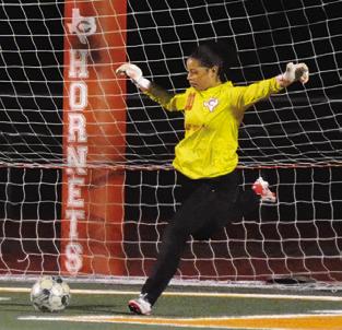 LADY HORNET GOALIE Mercy Chollett sets to kick the ball away from the goal during Caldwell’s game against Florence on Friday. Tribune photo by Denise Squier
