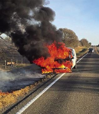 THIS POSTAL Service van burns on Dec. 31 off F.M. 3058. See story inside. Photo courtesy of Caldwell VFD