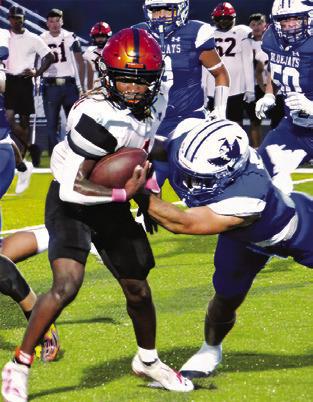 HERSCHEL CONWAY carries the ball against Snook. The Yeguas won 20-14 in overtime.