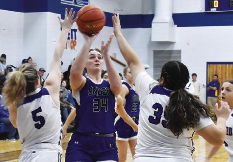 SNOOK’S ALEXIS MACIK is double-teamed by Mumford’s Senovia Tisdale and Olivia Rodriguez during the Snook-Mumford game on Friday in Mumford. -- Tribune photo by Roy Sanders