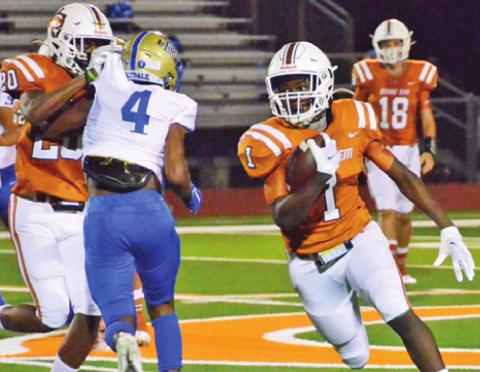 JAMAR HEWITT CARRIES the ball on Friday against Rockdale.