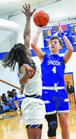 JUSTIN HRUSKA takes a shot against Mumford. -- Tribune photo by Roy Sanders
