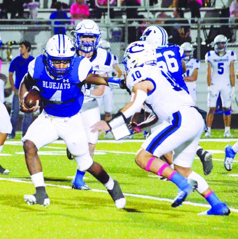 DOMINICK HANKINS CARRIES the ball last Friday against Falls City in Snook. Snook lost 28-0 and faces Yorktown this Friday in Yorktown.