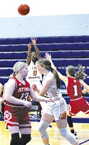 AMOREE DENSON takes a shot in the first quarter against St. Paul at the Yoakum Tournament. -- Photo by Mark Lube/Shiner Gazette