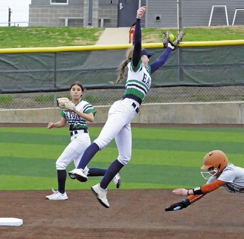 CALDWELL’S BREAN SIMS dives to slide into second base as a (Fort Worth) Eaton player is pulled off the bag by a throw during a tournament game at Lady Hornet Field. -- Tribune photo by Denise Squier