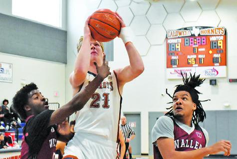 HARRISON NOVAK SHOOTS against Waller JV. The Hornets won 55-48 at the Kolache Capital Tournament. -- Tribune photo by Roy Sanders