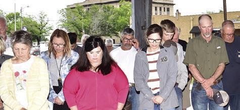THE CROWD BOWS their heads in prayer during the National Day of Prayer celebration in Caldwell. -- Tribune photo by Roy Sanders