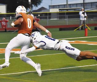 COY BECKA ELUDES this Robinson defender. Caldwell lost to the Rockets 31-20. Tribune photo by Roy Sanders
