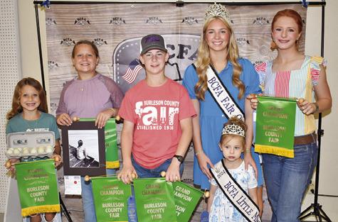 CAYLE CANON WON grand champion in senior horticulture, Kes Canon in intermediate acrylic and horticulture, Blakely Kemper for a picture and Hayden Kemper for horticulture, eggs. Joining them are Fair Queen Hadleigh Novosad and Little Miss Avery Grace Freeman.
