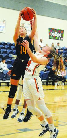 CADIE COSTON fights for a rebound during the Lady Hornets’ home game Friday against Thorndale. -- Tribune photo by Denise Squier