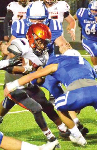 SOMERVILLE’S VERKOBE Woodberry carries the ball as Snook’s Garrett Lero makes a tackle. -- Tribune photo by Miranda Jones