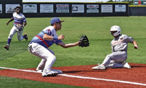 KORBIN BURNS SLIDES safe into third base in the Brookshire Royal game. Tribune photo by Roy Sanders