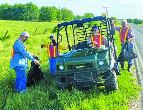 MANY VOLUNTEERS PICKED up trash and debris along roadways during last Saturday’s clean-up event in Snook.