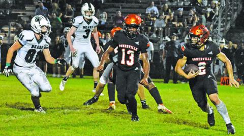 SOMERVILLE QUARTERBACK IAN Teague carries the ball as Keke Daniels gets ready to block against Brentwood Christian School. -- Tribune photo by Roy Sanders